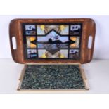 A wooden inlaid tray decorated with butterfly wings together with a Paua shell tray with a metal sur