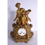 A LARGE 19TH CENTURY FRENCH GILT METAL MANTEL CLOCK with figural terminal. 45 cm x 22 cm.
