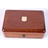 A small wooden cased music box 5 x 3 x 8 cm.