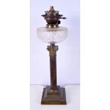 A Victorian brass column and glass oil lamp base 54 cm
