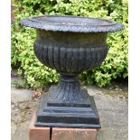 A COUNTRY HOUSE CAST IRON PEDESTAL GARDEN URN. 52 cm x 54 cm.