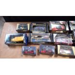 A collection of boxed Burago model cars together with other models (12) in two boxes.
