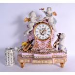 A LARGE CONTINENTAL PINK AND BISQUE PORCELAIN MANTEL CLOCK embellished with flowers and vines. 42 cm