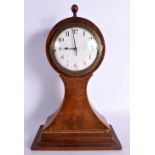 AN EDWARDIAN MAHOGANY MANTEL CLOCK. 35 cm 14 cm.