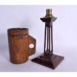 A RARE GEORGE IV TREEN CARVED WOOD ALE MUG together with an arts and crafts candlestick. Largest 24