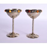 A LOVELY PAIR OF EARLY 20TH CENTURY CONTINENTAL SILVER AND AMBER CUPS. 192 grams. 11.5 cm x 7.5 cm.