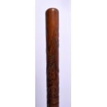 A 19TH CENTURY CONTINENTAL CARVED WOOD WALKING CANE decorated with masks and foliage. 88 cm long.