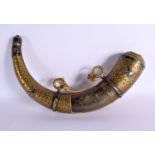 AN ANTIQUE MIDDLE EASTERN BRASS OVERLAID CARVED POWDER HORN. 28 cm wide.