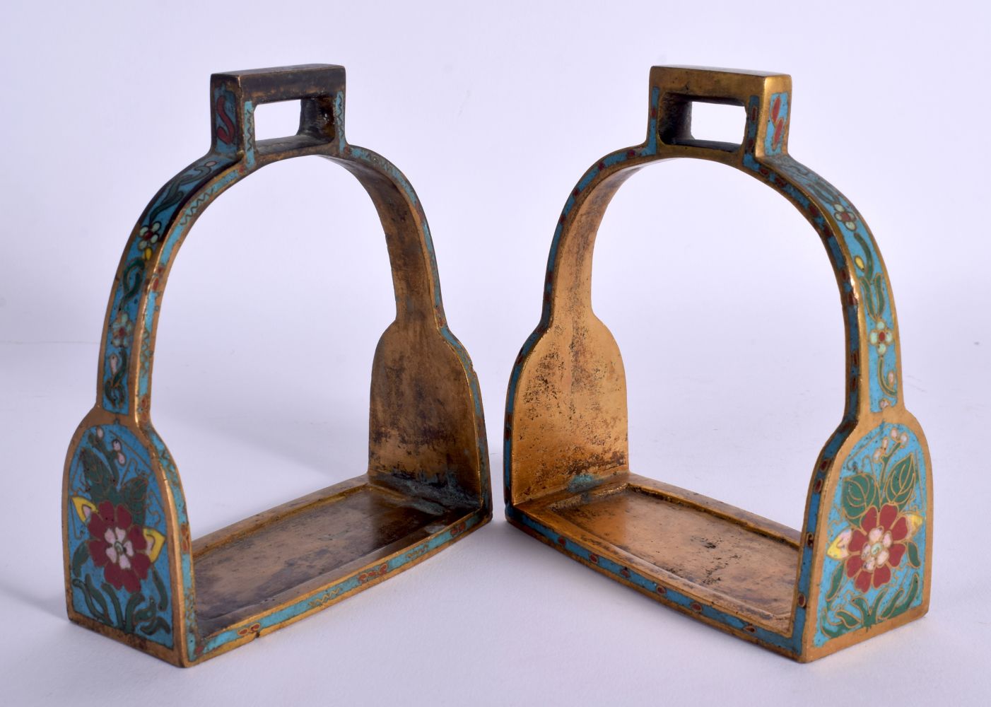 A RARE PAIR OF 19TH CENTURY CHINESE CLOISONNE ENAMEL BRONZE STIRRUPS Qing, decorated all over with f