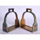 A RARE PAIR OF 19TH CENTURY CHINESE CLOISONNE ENAMEL BRONZE STIRRUPS Qing, decorated all over with f