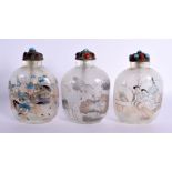 A SET OF THREE EARLY 20TH CENTURY CHINESE REVERSE PAINTED SNUFF BOTTLES AND STOPPERS decorated with