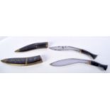 A pair of horn handled Kukri in horn brass bound sheath largest 33 cm (2).