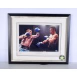 A framed, signed and authenticated boxing photograph of Ricky Hatton vs Kostya Tszyu, 2005. 25 x 37c