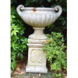 A LARGE COUNTRY HOUSE TWIN HANDLED PEDESTAL GARDEN URN. 86 cm x 62 cm x 48 cm.