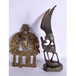 AN EARLY INDIAN BRONZE BUDDHISTIC SHRINE BACKING together with a carved horn hawk. Largest 30 cm hig
