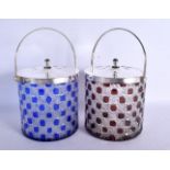 A PAIR OF SILVER PLATED GLASS BISCUIT BARRELS. 21 cm high inc handle.