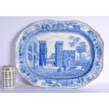 A LARGE SPODE POTTERY CARAMANIAN MEAT SERVING PLATE depicting the Castle of Boudron, with border de
