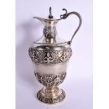 AN ANTIQUE INDIAN WHITE METAL EWER decorated with Buddhistic figures. 26.5 cm high.