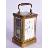 BRASS CARRIAGE CLOCK. 17cm high (handle up) x 8.5cm x 7.5cm with key