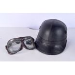 A vintage motor cycle helmet together with a pair of goggles (2)