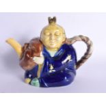 A 19TH CENTURY EUROPEAN MAJOLICA TEAPOT AND COVER Possibly Minton, formed as a Chinaman. 20 cm x 15