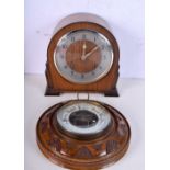 A small Art Deco style wooden mantel clock together with a carved wood framed barometer. 22 x 21cm (