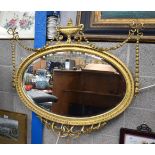 A LARGE NEO CLASSICAL GILT WOOD MIRROR formed with trailing swags and vines. 100 cm x 75 cm.