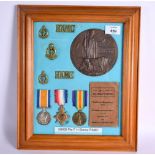 A FRAMED COLLECTION OF MEDALS AND OTHER EMPEMORA RELATING TO 59008 PTE FREDERICK HENRY STEMP OF THE