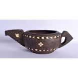AN UNUSUAL TRIBAL BONE INLAID CARVED WOOD POURING BOWL decorated with birds and motifs. 34 cm wide.
