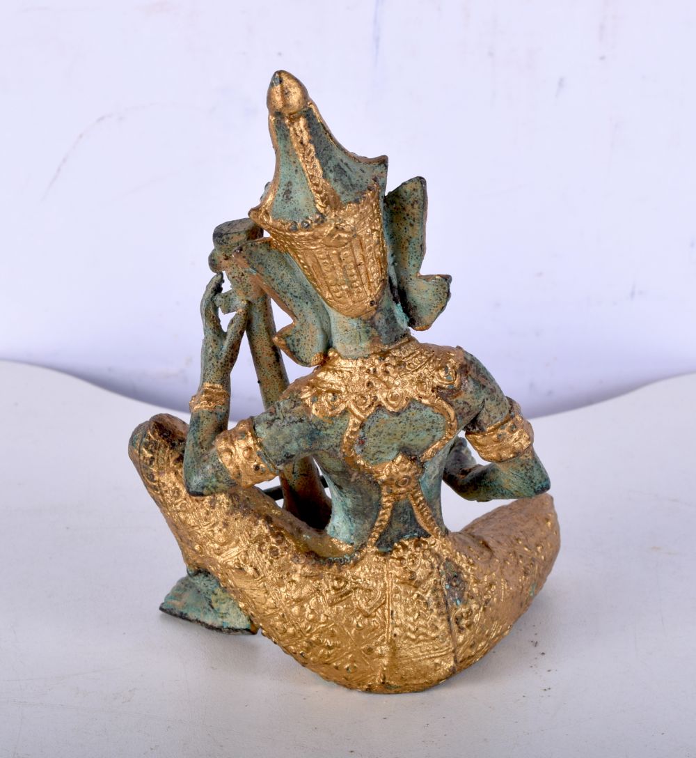 A small South East Asian bronze musician with gilt decoration. 14cm. - Image 2 of 4