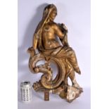 A LARGE 18TH/19TH CENTURY CONTINENTAL CARVED GILTWOOD FIGURE OF A FEMALE modelled on a scrolling fra