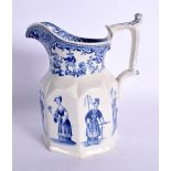 AN UNUSUAL ANTIQUE BLUE AND WHITE JUG printed with figures. 17 cm high.