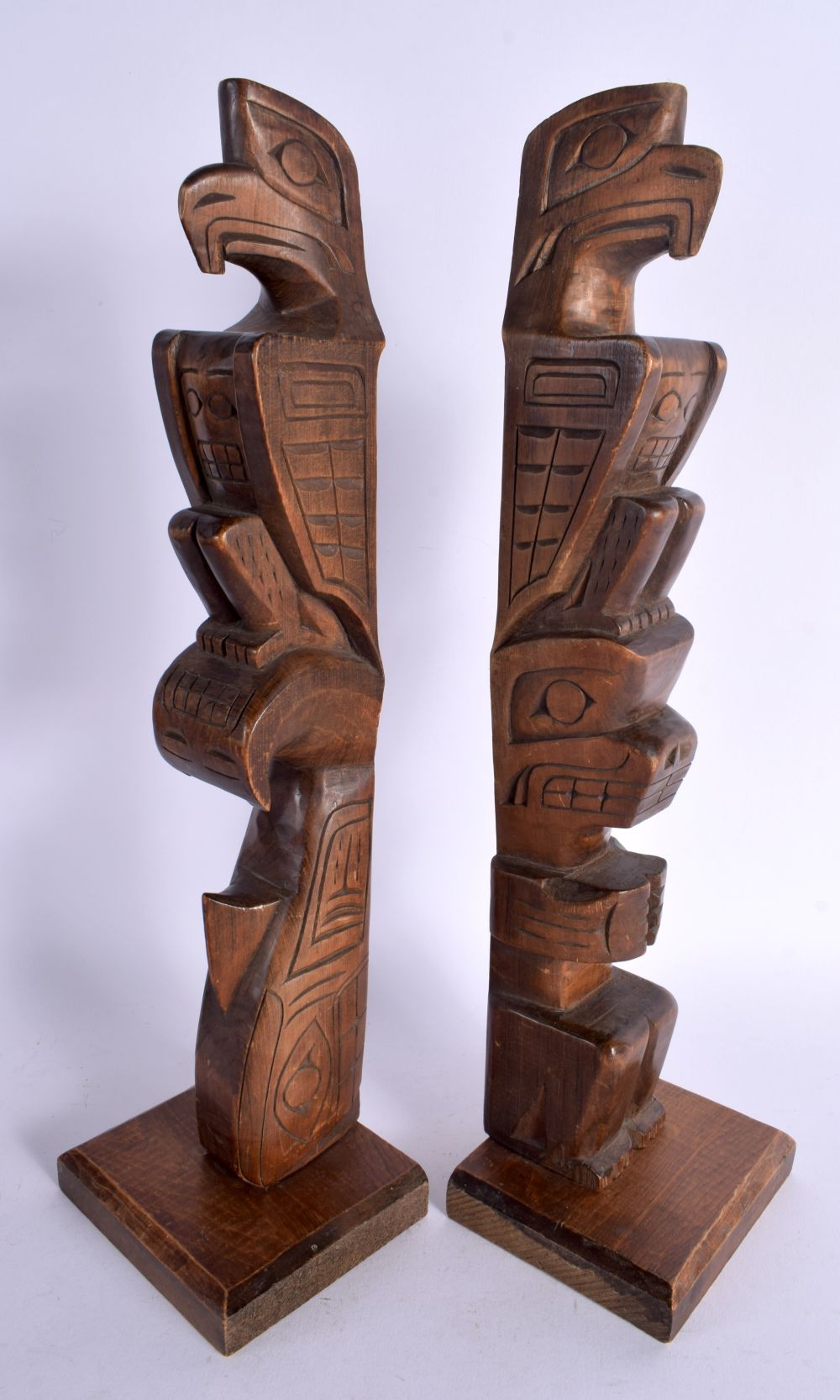 A LARGE PAIR OF NORTH AMERICAN CORMORANT ISLAND ALERT BAY HAIDA FIGURES modelled upon a rectangular - Image 2 of 3