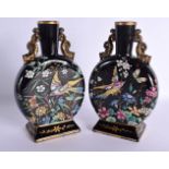A PAIR OF 19TH CENTURY ENGLISH AESTHETIC MOVEMENT POTTERY MOON FLASKS Attributed to Ridgways. 23 cm