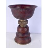 An Indian brass and copper urn