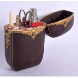A REGENCY LEATHER AND GILT METAL ETUI containing bone and white metal utensils. 9 cm x 5 cm.