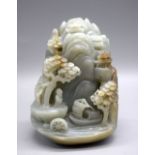 A Chinese carved Jade boulder depicting a lake and mountains 10 x 8 cm