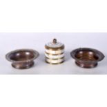 A pair of small bronze and wooden dishes together with a small metal and mother of pearl lidded pot.