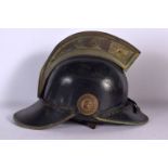 A VINTAGE FIREMANS HELMET. 27 cm x 22 cm.