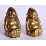 A PAIR OF CIRCA 1908 GERMAN BRASS BILLIKINS. 4.3cm x 2.7cm x 2.7cm (2)