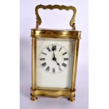 A FRENCH BRASS CARRIAGE CLOCK. 15 cm high inc handle.