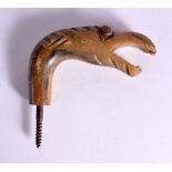 A 19TH CENTURY MIDDLE EASTERN CARVED RHINOCEROS HORN HANDLE in the form of a birds head. 10 cm x 8 c