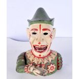 A vintage cast iron novelty money box in the form of a clown 19 cm