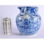 A LARGE EARLY 19TH CENTURY ENGLISH BLUE AND WHITE JUG decorated with building and farm house. 20 cm
