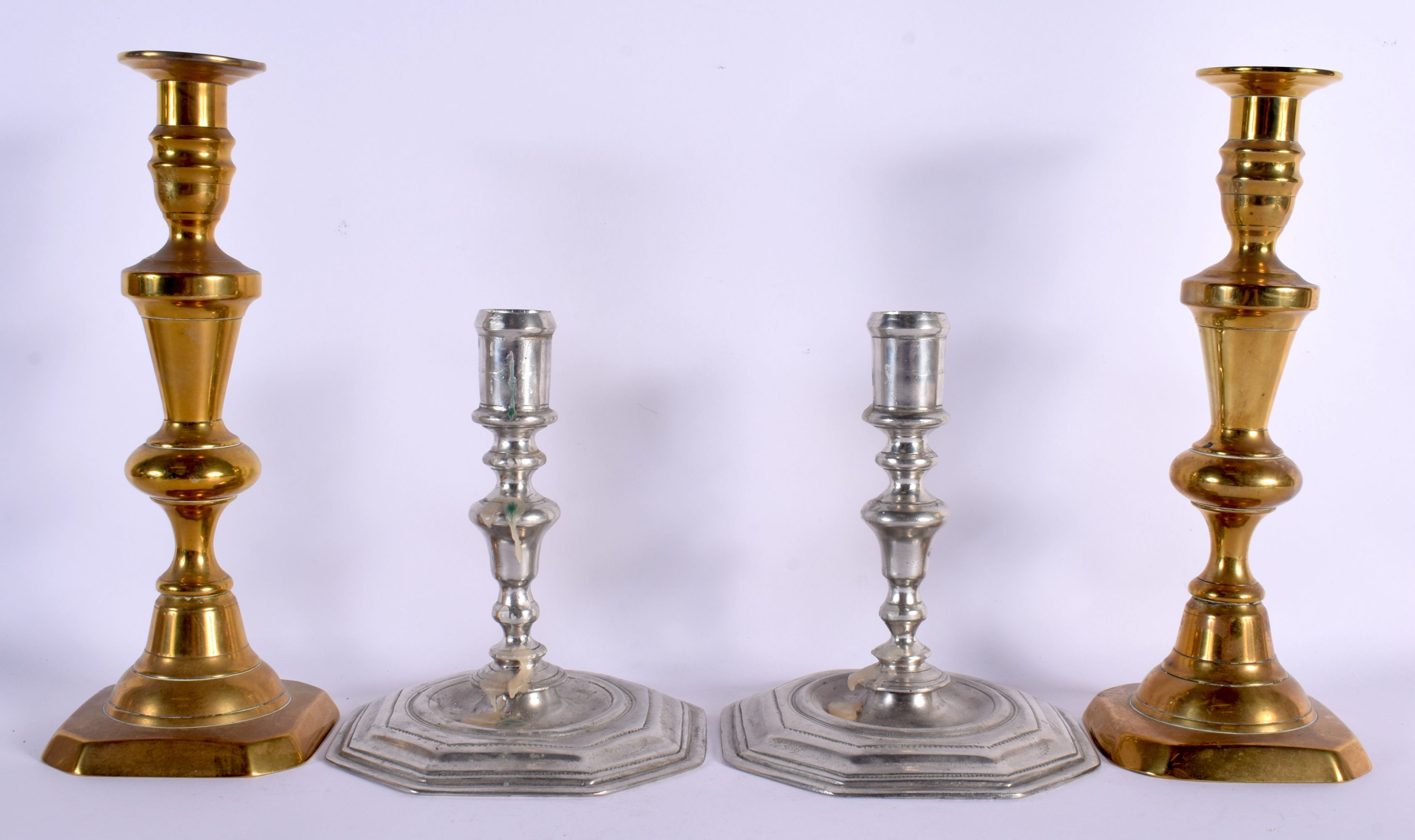 TWO PAIRS OF ANTIQUE CANDLESTICKS. Largest 30 cm high. (4)