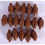 A COLLECTION OF 19TH CENTURY CHINESE CARVED WOOD PRAYER BEAD NUTS Qing, in the form of figures. Larg