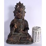AN EARLY CHINESE LACQUERED BRONZE FIGURE OF A BUDDHA Ming/Qing, modelled holding a vessel, engraved