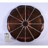 A LARGE ARTS AND CRAFTS COPPER WAS BENSON FLORAL CHARGER. 44 cm wide.