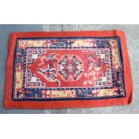 A CHINESE HAND WOVEN WOOL RUG. 80 cm x 50 cm.