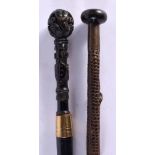 AN EARLY 20TH CENTURY FRENCH BRONZE LEATHER AND WOOD STICK together with a continental carved wood c